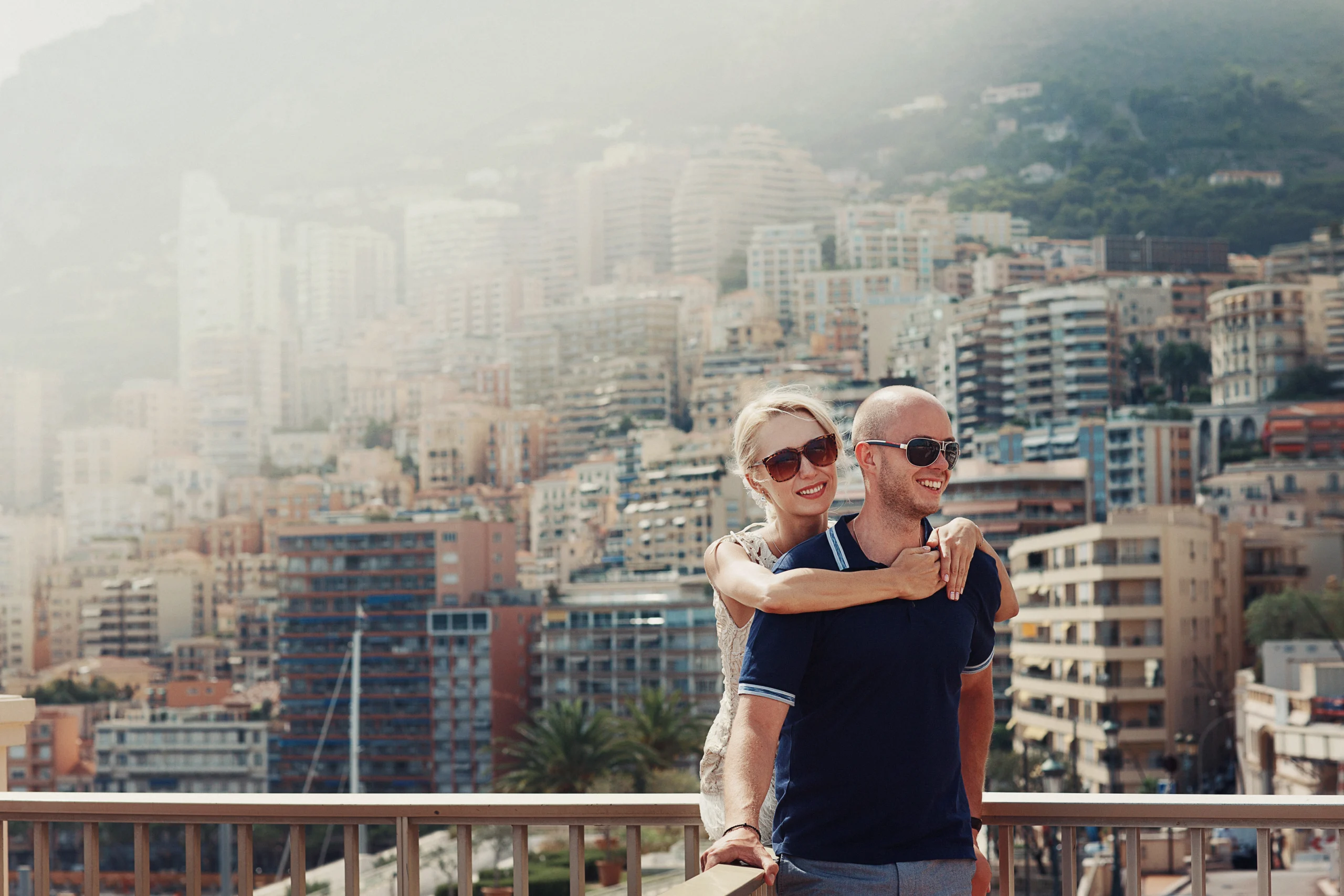 blonde-lady-hugs-bald-headed-man-with-great-cityscape